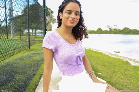 Latina in a Skirt and Sneakers Shows Her Enhanced Tits Outdoors – photo 6 of 15