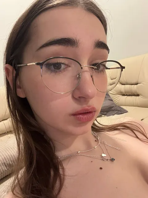 Brunette with Glasses Takes a Facial in a Selfie – photo 11 of 21