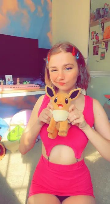 Redhead with Natural Tits Lets Clothes Fall and Poses Nude