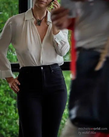 Mature Woman with Big Tits Poses Clothed in Public