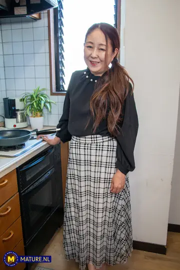 Mature Asian Woman Strips Out of Her Skirt