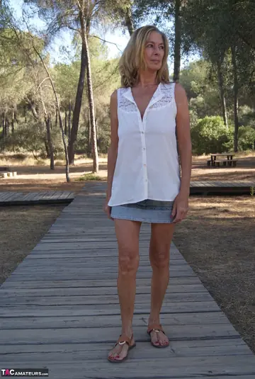 Mature Woman in Lingerie and Skirt Spreads Her Hairy Pussy Outdoors