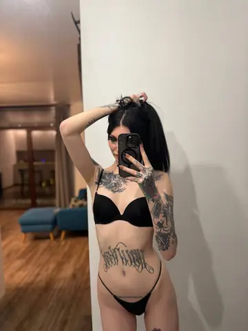 Petite Brunette with Natural Tits Strips and Poses