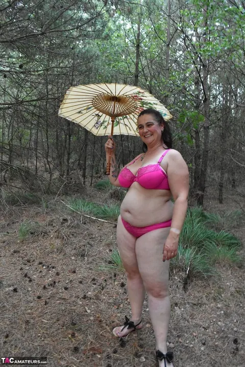 Mature Chubby Woman in a Bikini Strips Nude in a Forest Clearing – photo 16 of 16