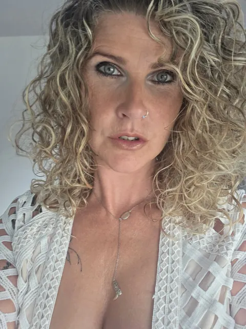 MILF with Piercing Strips Nude and Poses for the Camera – photo 2 of 10