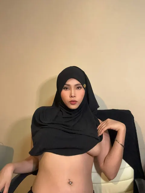 Asian Woman with Big Natural Tits Poses in Her Clothes – photo 9 of 10