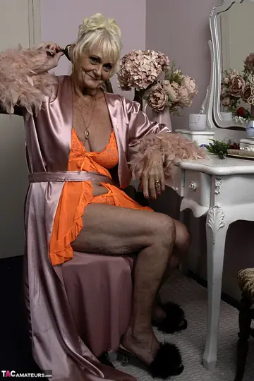 Mature Blonde Woman in Sheer Lingerie Spreads Her Hairy Pussy