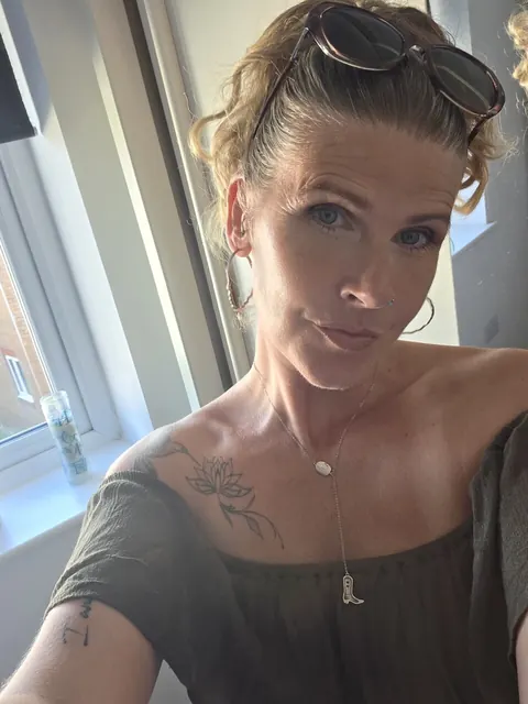 MILF with Piercing Strips and Poses Nude – photo 9 of 10