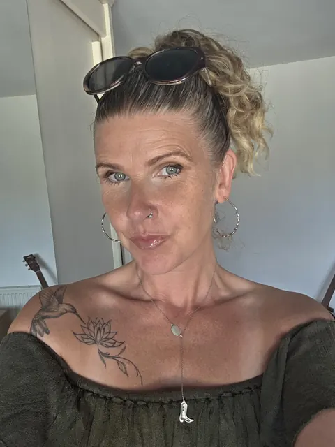 MILF with Piercing Strips and Poses Nude – photo 6 of 10