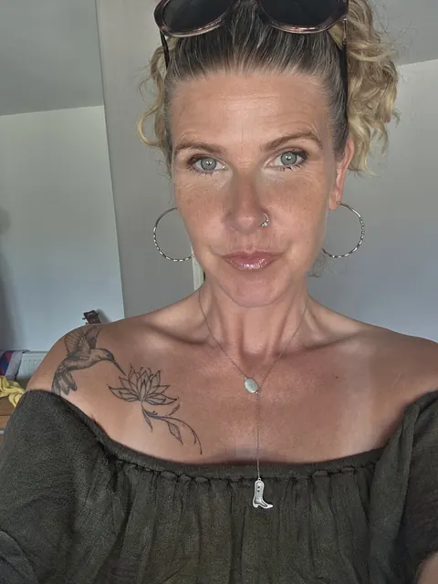 MILF with Piercing Strips and Poses Nude – photo 8 of 10