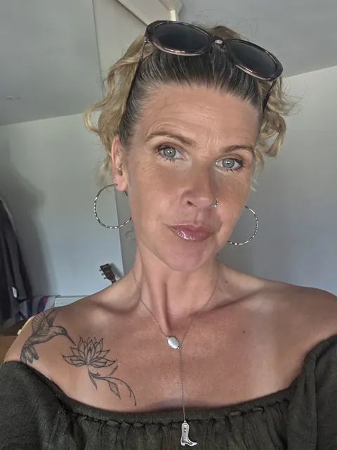 MILF with Piercing Strips and Poses Nude – photo 7 of 10