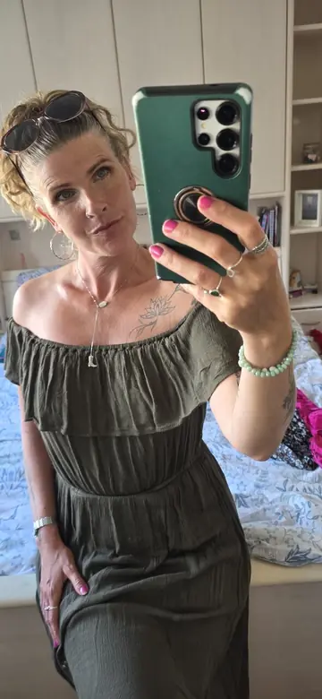 MILF with Piercing Strips and Poses Nude