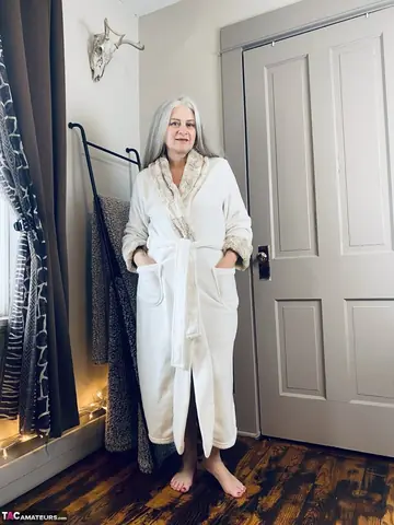 Mature Curvy Blonde Poses in a Thong and Robe