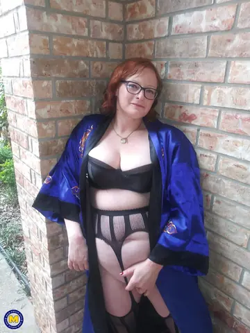 Mature Redhead in Lingerie Uses a Toy