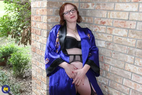 Mature Redhead in Lingerie Uses a Toy – photo 3 of 16