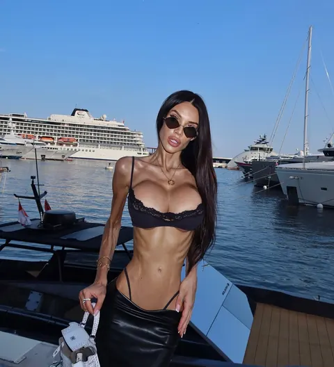 Skinny Brunette with Enhanced Tits Strips Nude and Poses – photo 4 of 10
