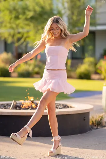Tanned Blonde in a Dress and Glasses Strips in Public