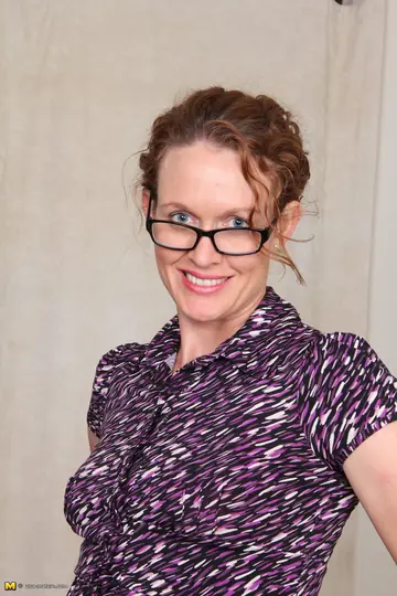 Roxanne Clemmens – Mature Curvy Redhead Secretary Strips Off Her Panties at the Desk