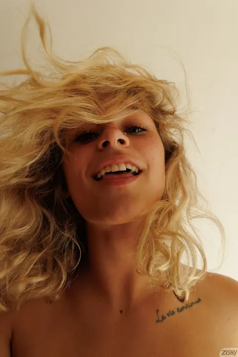 Jezebel Madd: Tall Blonde with a Tattoo Undresses and Shows Her Bare Ass – photo 10 of 13