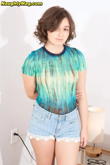 Short-Haired Brunette in Shorts Gives a Blowjob