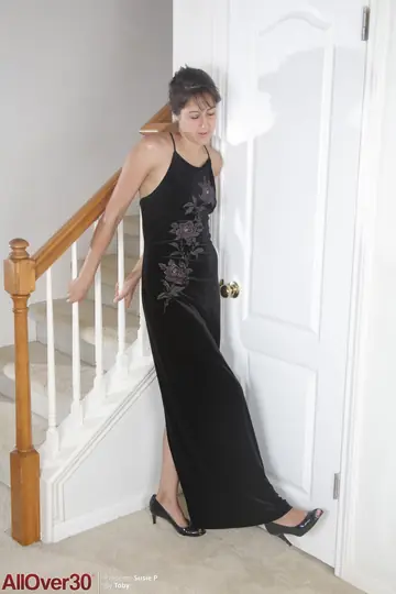 MILF Strips Out of Her Black Dress and Lingerie Near Stairwell