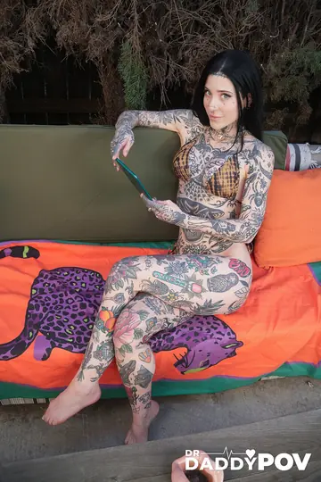Tattooed Brunette in a Bikini Takes Anal Doggy Style on a Sofa