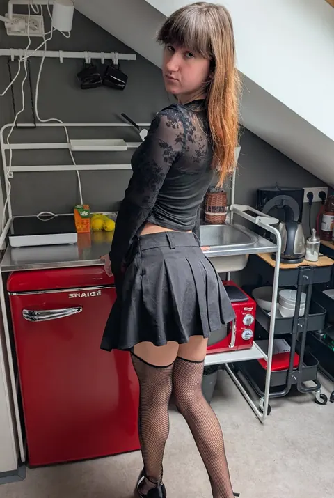 Brunette Shows Her Panties and Stockings in a Miniskirt – photo 8 of 10