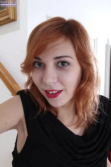 Nancy Reid – Redhead Slips Off Her Panties and Fingers Her Shaved Pussy