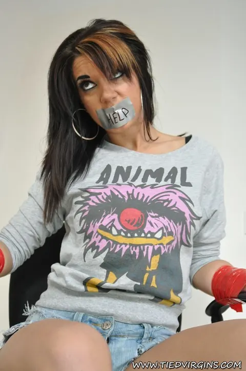 Tattooed Woman Bound and Gagged with Tape in the Office – photo 11 of 12