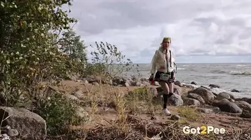 Blonde European in a Skirt Spreads Her Hairy Bush on the Beach
