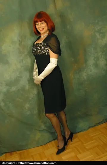 Busty Redhead MILF Poses in Lingerie, Stockings and Glasses