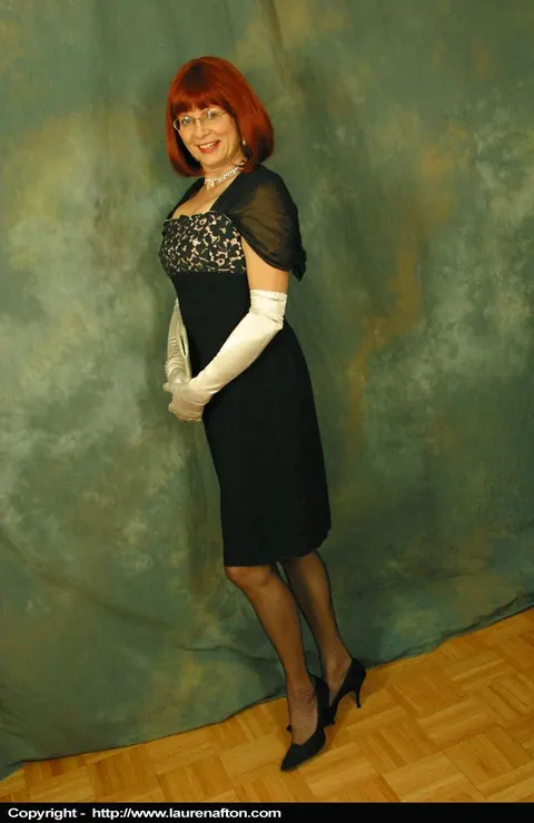 Busty Redhead MILF Poses in Lingerie, Stockings and Glasses – photo 1 of 12