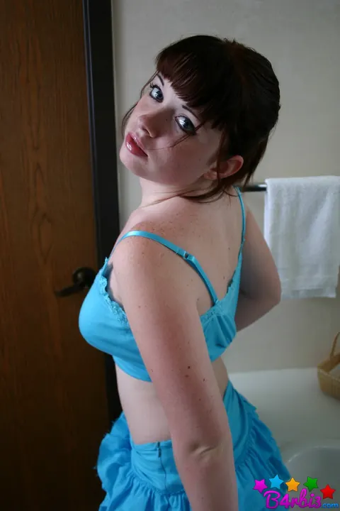 B4rbi3: Busty Brunette in a Skirt and Socks Fingers Herself in the Bathroom – photo 4 of 12