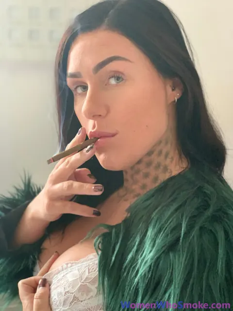 Tattooed Busty Brunette Poses in Lingerie While Smoking – photo 9 of 15