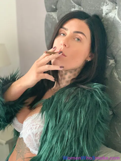 Tattooed Busty Brunette Poses in Lingerie While Smoking – photo 7 of 15