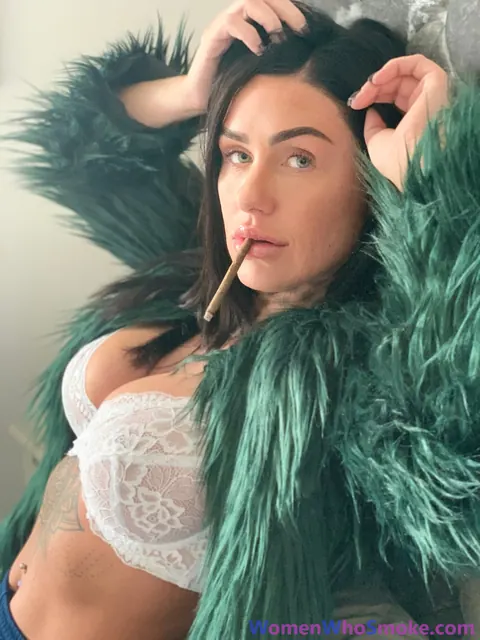 Tattooed Busty Brunette Poses in Lingerie While Smoking – photo 11 of 15