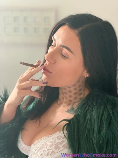 Tattooed Busty Brunette Poses in Lingerie While Smoking – photo 10 of 15