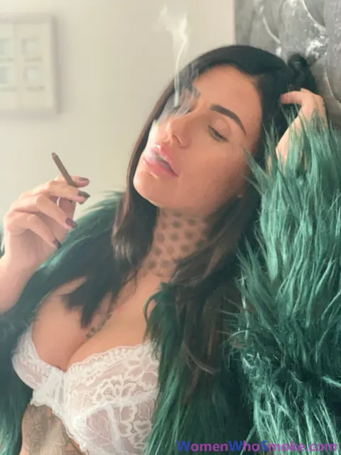 Tattooed Busty Brunette Poses in Lingerie While Smoking – photo 15 of 15