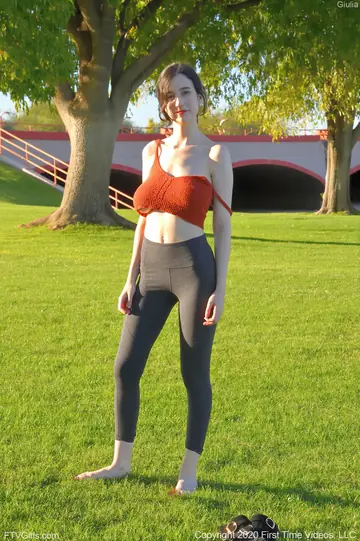 Slim Brunette Bares Her Big Tits in Yoga Pants on the Beach
