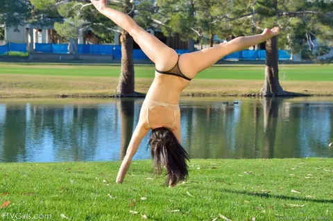 Flexible Woman in a Skirt and Heels Strips Nude Outdoors – photo 12 of 15