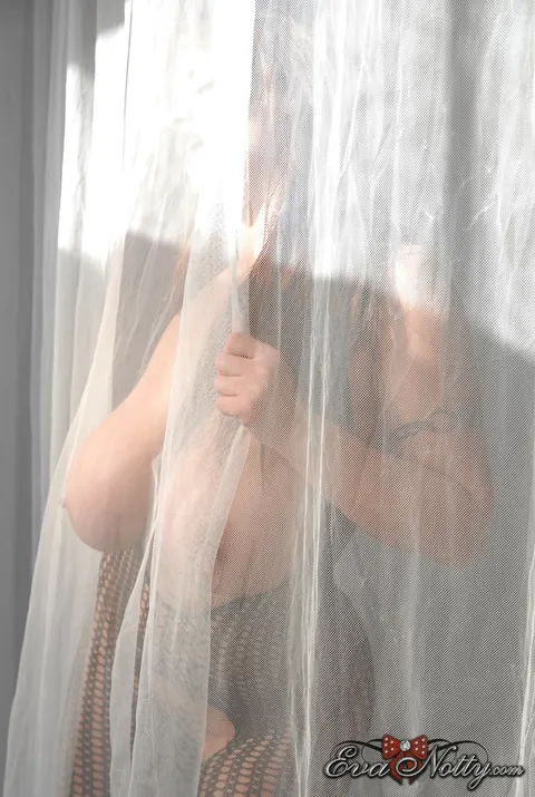 Eva Notty: Curvy Redhead MILF Flaunts Her Big Tits in Fishnet Bodysuit and Heels – photo 2 of 15