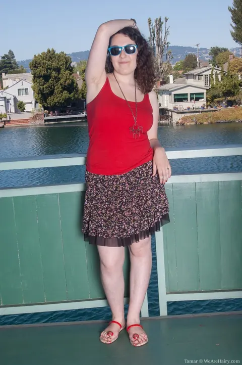 Brunette BBW Strips Out of Her Skirt on a Balcony Overlooking the River – photo 1 of 11