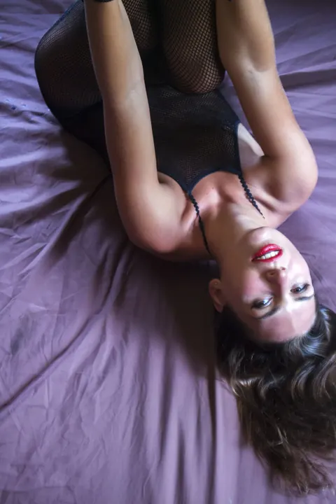 Woman Strips Out of Her Fishnet Bodysuit and Spreads – photo 3 of 21
