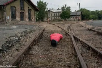 Lorelei Lee – Blonde MILF Dominates Bound Man with a Dildo on Train Tracks