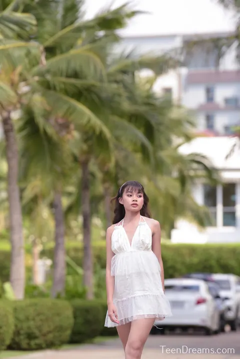 Woman Strips Out of Her Dress by the Pool – photo 3 of 21