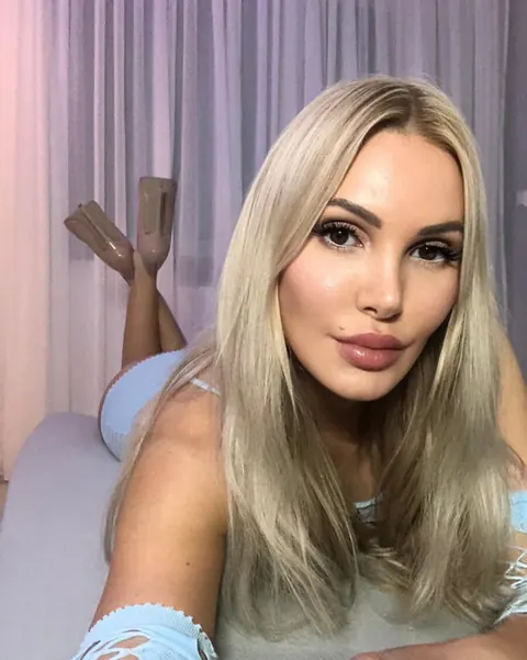 Thick Blonde with Big Tits Shows Off Her Ass in Stockings – photo 18 of 18