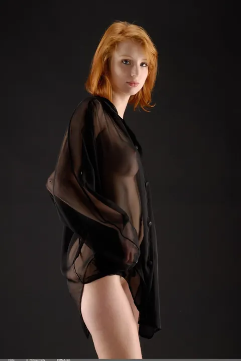 Woman Undresses for a Photo Shoot – photo 3 of 21