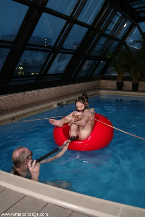Tall Asian Woman Bound in Water Bondage – photo 7 of 21