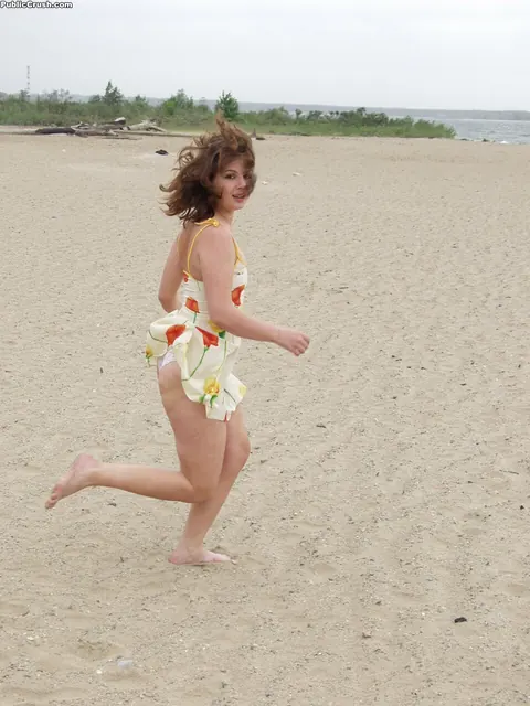 Brunette Wades into Surf and Bares Her Hairy Pussy on the Beach – photo 1 of 16