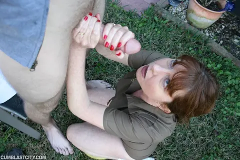 Dee Delmar: Busty Redhead MILF Jerks Her Partner Off Outdoors for a Facial – photo 9 of 16